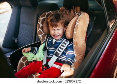 Crying Baby Boy In Car Seat.