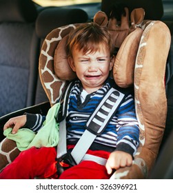 Crying Baby Boy In Car Seat.