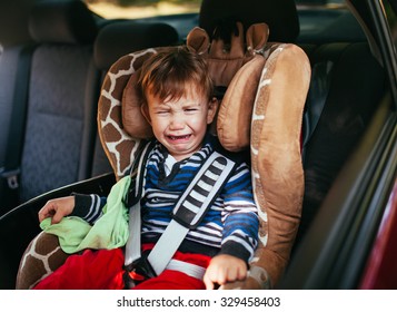 Crying Baby Boy In Car Seat.