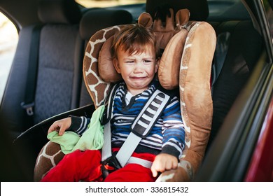 Crying Baby Boy In Car Seat.