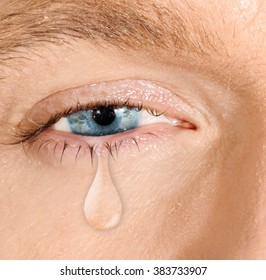 Crying blue eye of caucasian white man. concept of sadness, fear,love pains, mental depression disease,  eyewash and eye health 