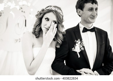 Crying Bride With The Groom In The Wedding Celebration