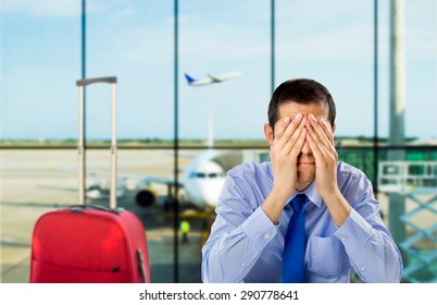 crying businessman who delayed flight at an airport