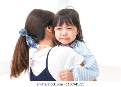 Crying child and mother