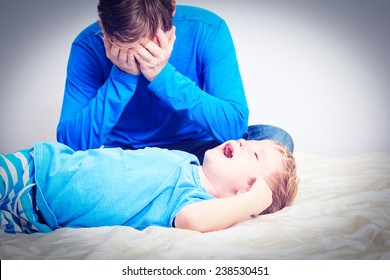 Crying Child, Tired Father- Difficult Parenting