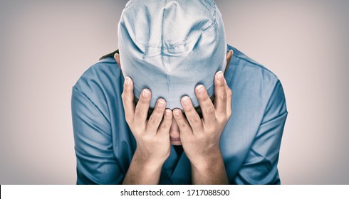 Crying Doctor During COVID-19 Needing Help In Hospital. Healthcare Workers In Despair Over Emergency Need Of PPE And Distress. Coronavirus Crisis Death, Dispair, Mental Health Anxiety.