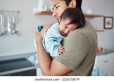 Crying, Down Syndrome Baby And Father Holding, Comforting And Consoling Upset Child In Their Home With A Caring Parent. Asian Man Or Dad Showing Love For Special Needs Infant Girl During Family Time