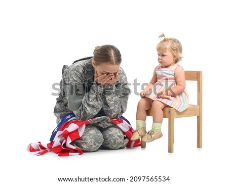 Crying female soldier with USA flag and her baby girl on white background