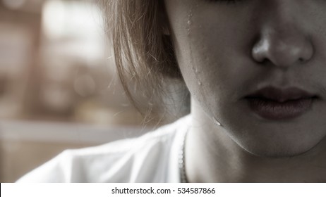 Crying Lady. Selected Focus At A Drop Pf Tear .