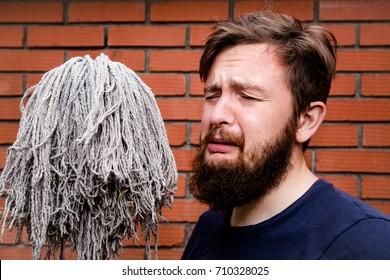 crying man with broom