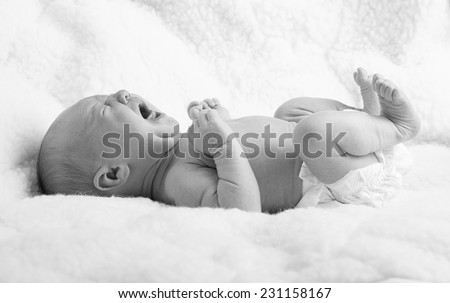 Similar – Newborn baby awake on a blanket