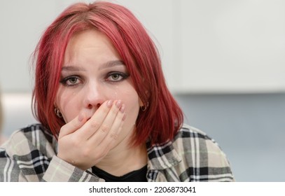 Crying Teen Girl Looks At Camera