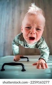 crying unhappy angry toddler standing at the kitchen counter wanting sweets dynamic photo
 - Shutterstock ID 2259163277