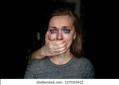 Crying woman after beating by her husband. Female violence concept. Help for women suffering from domestic, woman violence. Social, life problems and difficulties