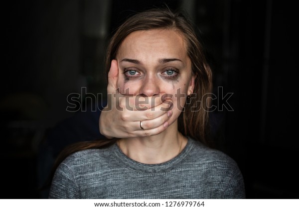 Crying woman after beating by her\
husband. Female violence concept. Help for women suffering from\
domestic, woman violence. Women\'s rights and gender\
equality