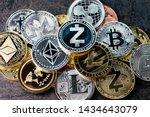 Crypto currency background with various of shiny silver and golden physical cryptocurrencies symbol coins, Bitcoin, Ethereum, Litecoin, zcash, ripple.