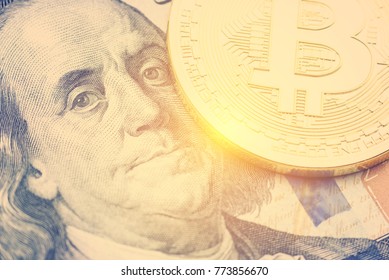 Crypto currency and bitcoin or digital payment concept : Gold coin with B letter, electronic circuit, US USD dollar. Bitcoin is popular, volatile, risk, decentralized, limited, hard to trace and tax.
