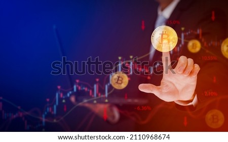 Crypto currency bitcoins high loss with red arrow down concept, Businessman touch bitcoins with arrows pointing down as Bitcoin BTC price falls, Cryptocurrency prices decline,Crypto Market Value down