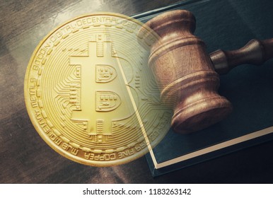 Crypto currency concept, wooden gavel on legal book and golden bitcoin