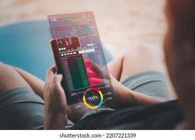 Crypto Currency, Investment, Online Trading And Stock Market Concepts. Asian Man Sitting Using Smartphone For Analyze Cryptocurrency Price On Online Market Before Buying Investing