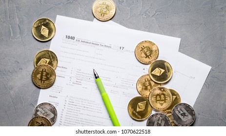 Crypto Currency: Pages Of The Tax Form 1040 And A Scatter Of Coins Bitcoin, Ethereum.