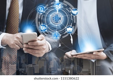 Crypto currency wallet concept - Businessman using crypto currency wallet application on mobile phone to transfer crypto currency coins to another person's wallet. - Powered by Shutterstock