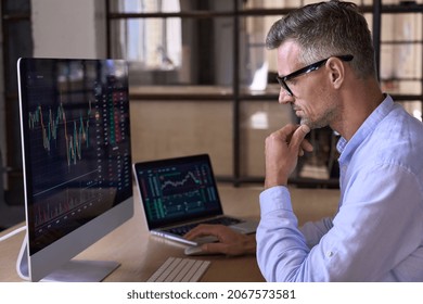 Crypto trader investor analyst broker using pc computer analyzing digital cryptocurrency exchange stock market charts graphs thinking of investing funds risks in trading platform global analytics. - Shutterstock ID 2067573581