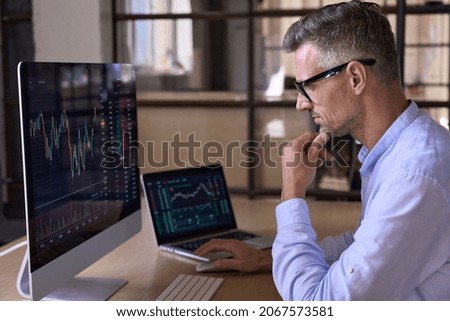 Crypto trader investor analyst broker using pc computer analyzing digital cryptocurrency exchange stock market charts graphs thinking of investing funds risks in trading platform global analytics.