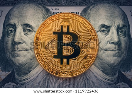 Cryptocurrency of the Bitcoin with Benjamin Franklin portrait from one hundred american dollars. Business concept of worldwide cryptocurrency. Earnings on cryptocurrency mining.