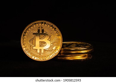 Cryptocurrency - Bitcoin stacked and isolated with a black background