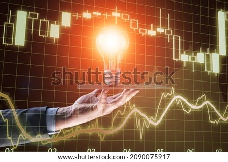 Cryptocurrency concept. Businessman holding iluminated light bulb with bitcoin icon. Imagine de stoc © 