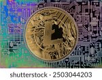 Cryptocurrency concept. A macro shot of Litecoin cryptocurrency coin on top of a rainbow printed PCB circuit.