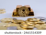  Cryptocurrency concept. Shining Monero cryptocurrency coin in front of five gold bars, isolated in white background. selective focus. 