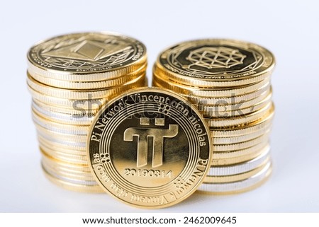 Cryptocurrency concept. Shining Pi Network cryptocurrency coin in front of two piles gold coins . selective focus. 