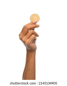 cryptocurrency, finance and business concept - close up of female hand holding golden bitcoin over white background - Shutterstock ID 2145134905