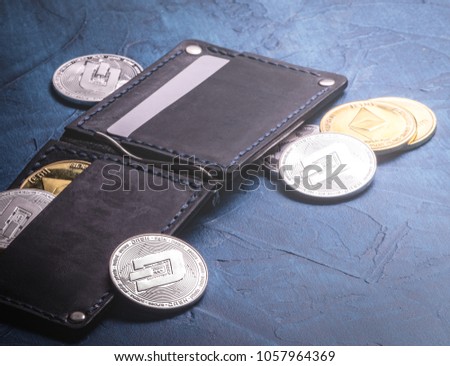Crypto-currency: Leather wallet with metal dashcoin coins