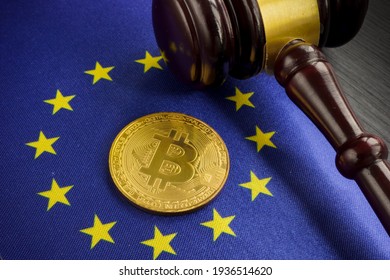 Cryptocurrency legal regulation in EU. Btc on the flag and gavel. - Shutterstock ID 1936514620