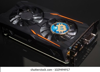 Cryptocurrency mining concept with bitcoin on a videocard 