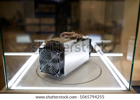 Cryptocurrency mining equipment - ASIC - application specific integrated circuit on farm stand at expo