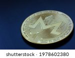 Cryptocurrency Monero coin on table and digital currency money concept