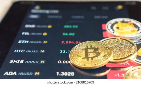Cryptocurrency on Binance trading app, Bitcoin BTC with BNB, Ethereum, Dogecoin, Cardano, Litcoin, altcoin digital coin crypto currency defi p2p decentralized finance and fintech banking market - Shutterstock ID 2108816903