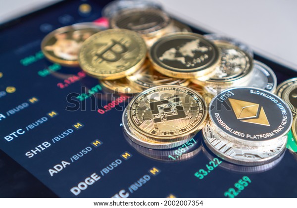Cryptocurrency on Binance trading app, Bitcoin BTC\
with BNB, Ethereum, Dogecoin, Cardano, Litecoin, altcoin digital\
coin crypto currency defi p2p decentralized finance and fintech\
banking market