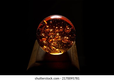 Crystal Ball With Air Bubbles Inside On Black Background