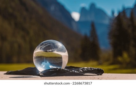 Crystal ball alpine summer landscape shot at the famous Tre Cime lookout, Toblach, Italy
