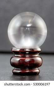 Crystal Ball On Wooden Stand. Vertical.