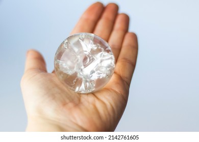 A crystal ball in the palm of your hand. A ball of glass