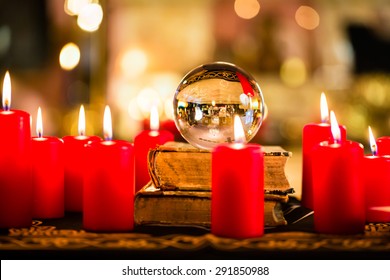 Crystal Ball To Prophesy Or Esoteric Clairvoyance During A Seance In The Candle Light