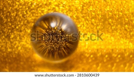 Crystal ball refracting and inverting bright gold sparkling glitter lights