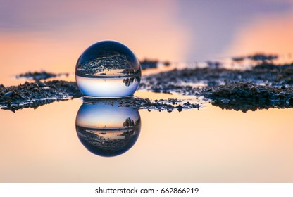 Crystal Ball With Sunrise Reflection