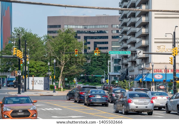 Crystal\
City, Virginia, USA - May 18, 2019: Buildings and vehicles on\
heavily trafficked Jefferson Davis Highway in Crystal City,\
location of Amazon HQ2 in Arlington County.\
